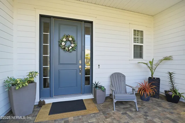 a hallway with mirror and window