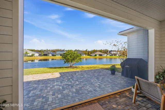 a view of a lake with houses in the back