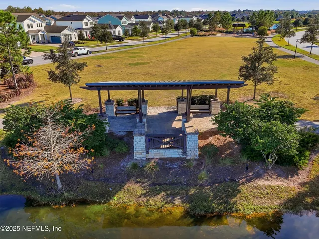 an aerial view of residential houses with outdoor space