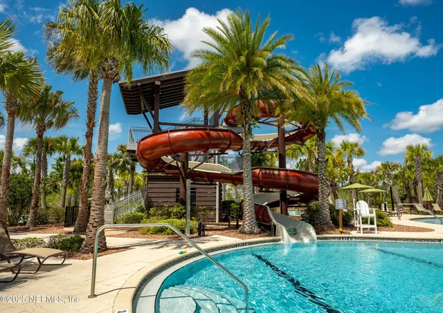 a view of a patio with table and chairs and potted plants