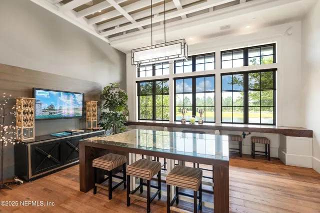 a living room with furniture and a book shelf