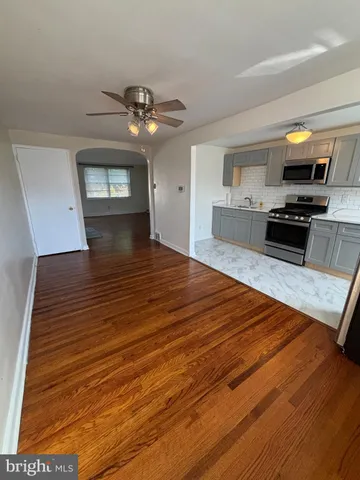 a view of kitchen with microwave stove refrigerator and microwave