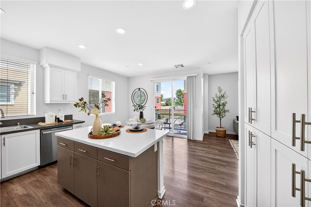 156 North Orange Avenue Brea, CA 92821 - Photo 11 of 44 a kitchen with a sink stove and cabinets
