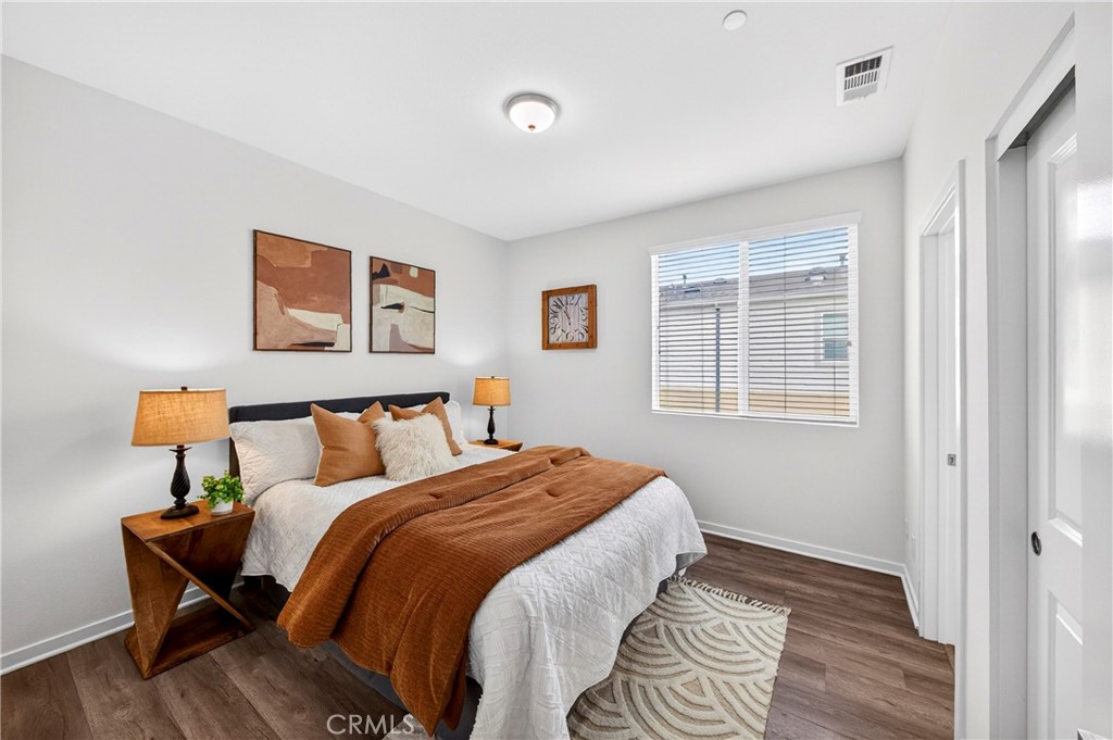 156 North Orange Avenue Brea, CA 92821 - Photo 25 of 44 a bedroom with a bed and wooden floor