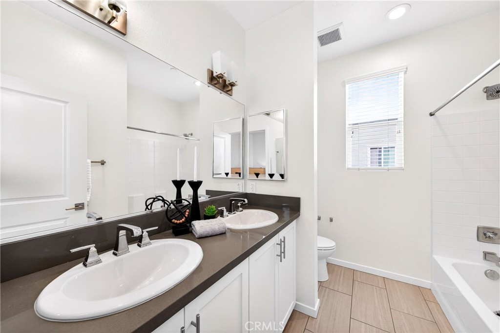 156 North Orange Avenue Brea, CA 92821 - Photo 29 of 44 a bathroom with a sink and a mirror