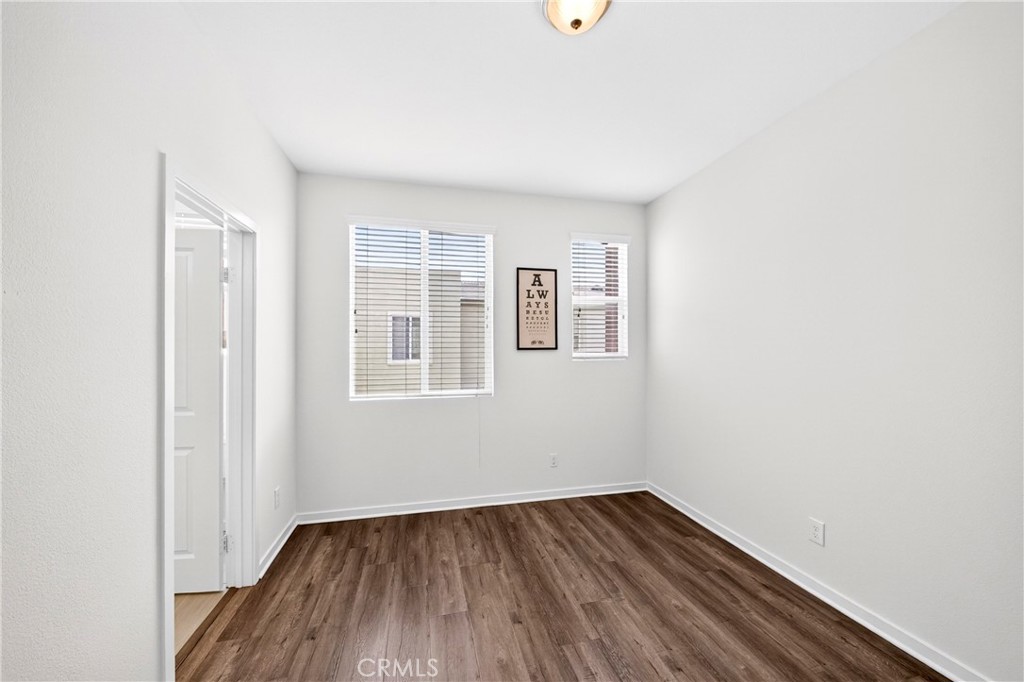 156 North Orange Avenue Brea, CA 92821 - Photo 33 of 44 a view of an empty room with wooden floor and a window