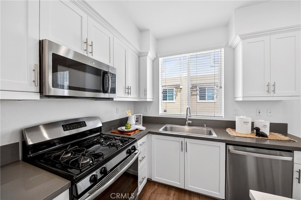 156 North Orange Avenue Brea, CA 92821 - Photo 7 of 44 a kitchen with a sink stove top oven and microwave