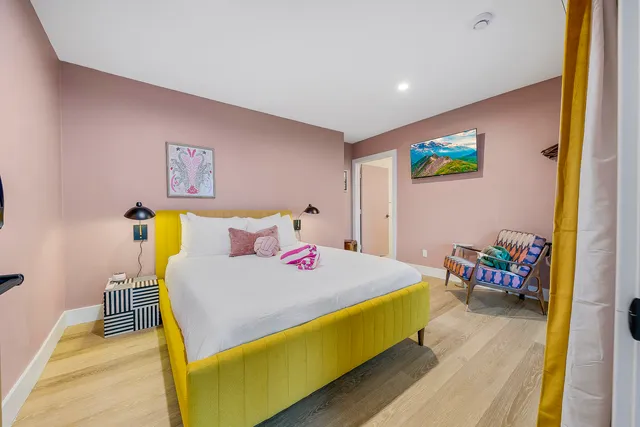 a bedroom with a bed and a table