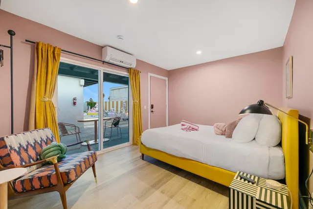 a bedroom with a bed and a table