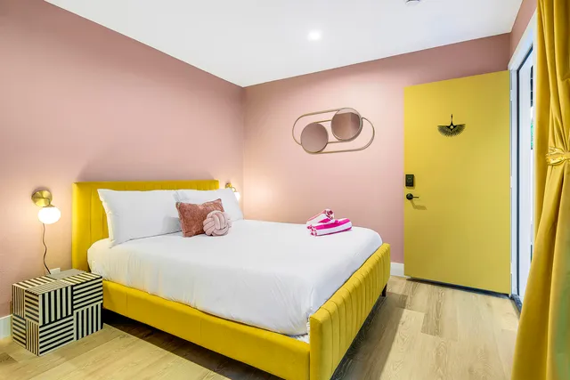 a living room with furniture and kitchen view