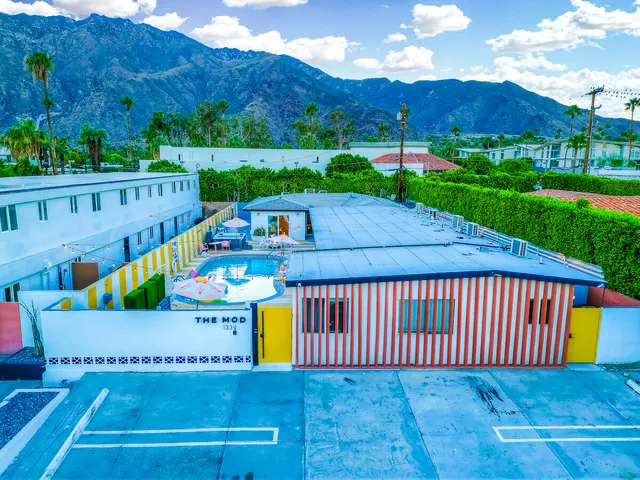 a room with lots of different furniture and wooden floor