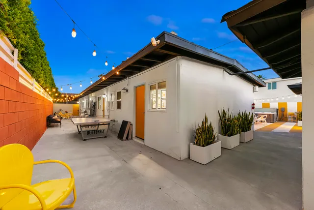 a view of sitting area with furniture and wooden fence