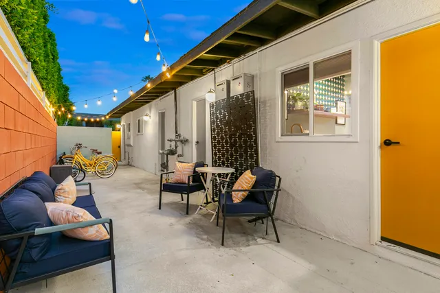 a view of swimming pool with outdoor seating
