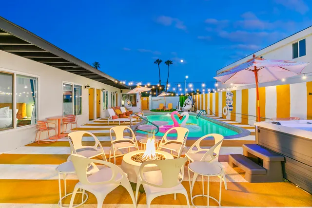 an aerial view of a house with swimming pool garden and barbeque oven