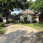 a front view of a house with a yard and porch