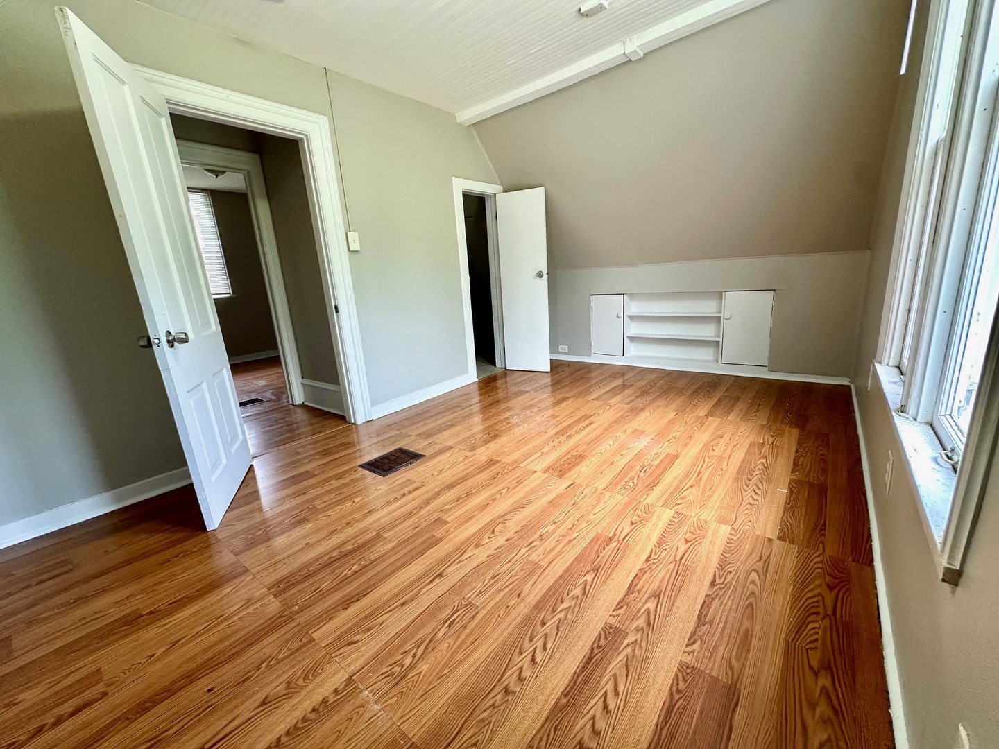 50 Sheridan Street Elgin, IL 60123 - Photo 18 of 21 a view of an empty room with wooden floor and a window