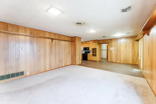 a view of an empty room with a window