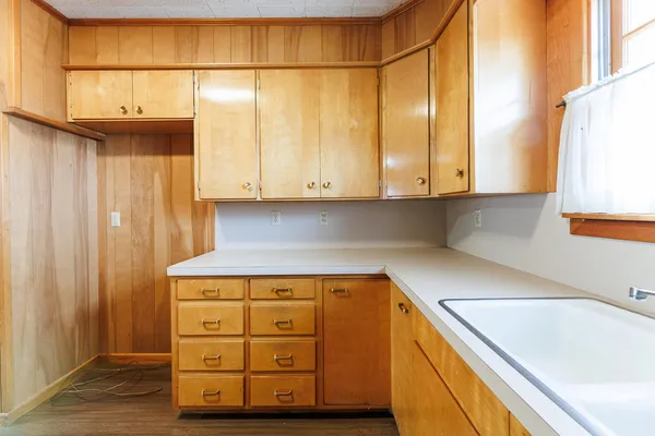a kitchen with a sink and a window