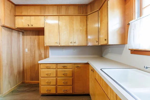 a kitchen with a sink and a window
