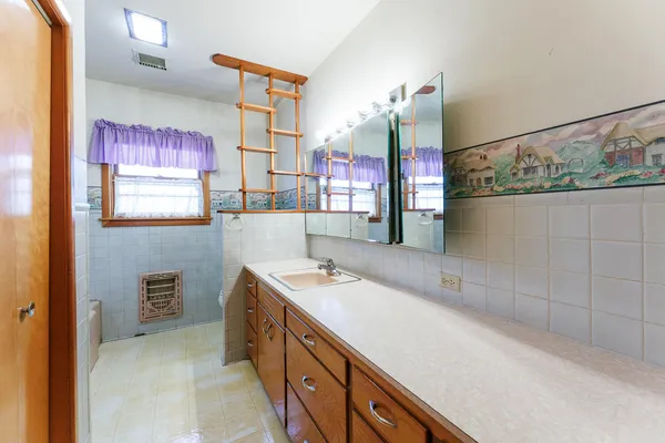 a bathroom with a sink and a mirror