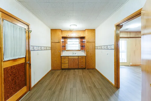 a kitchen with a stove and a refrigerator