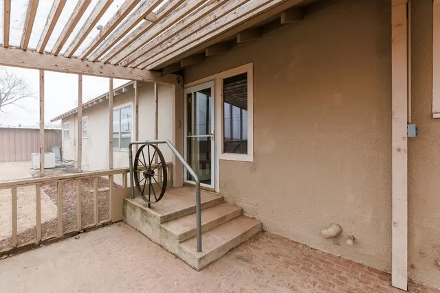 a view of an empty room with windows