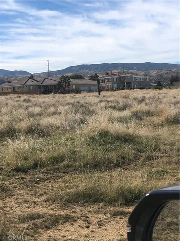 a view of a lake with mountains in the background