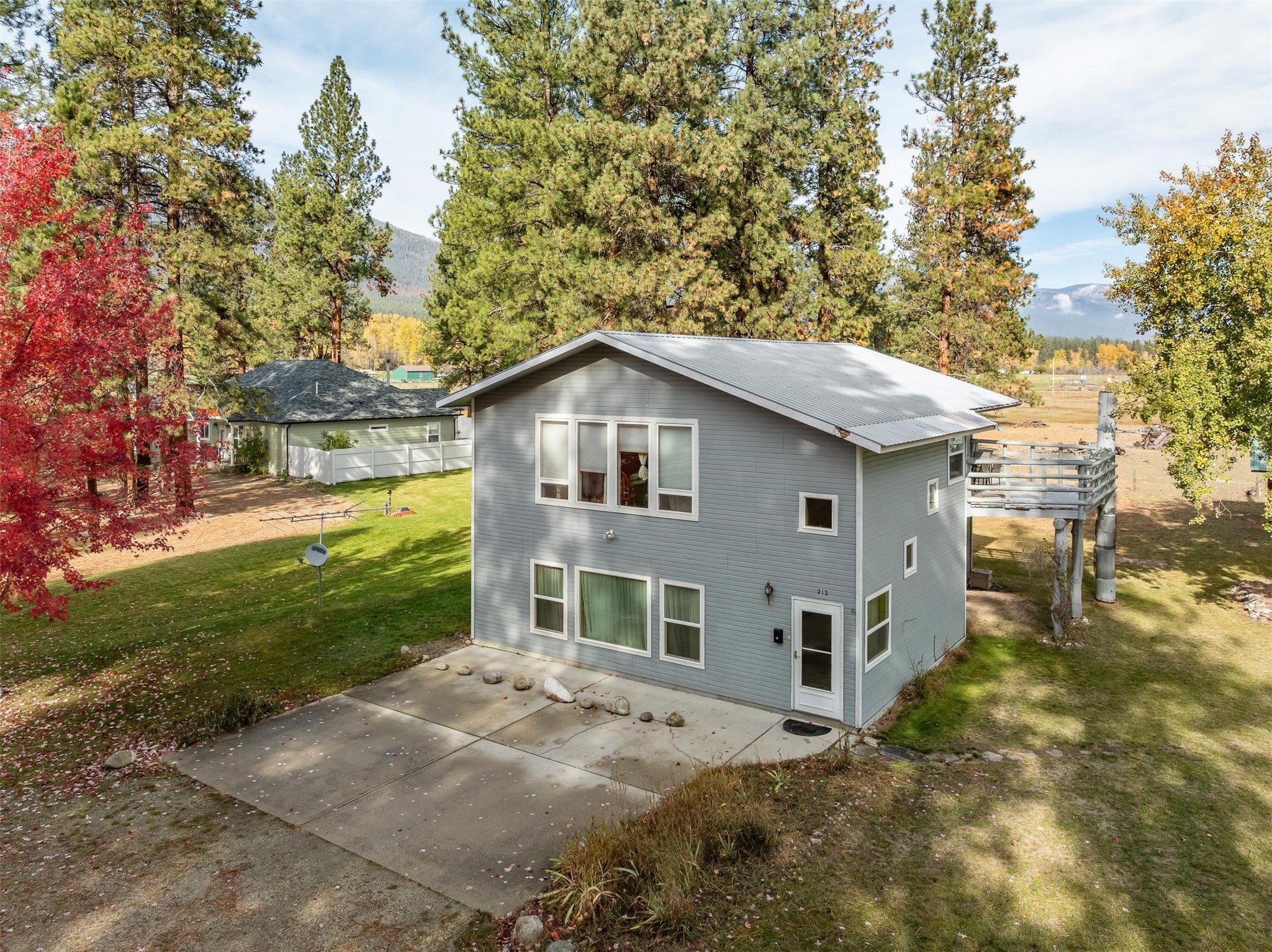 212 St Marys Road Stevensville, MT 59870 - Photo 4 of 39 Front of property featuring a patio area and a lawn