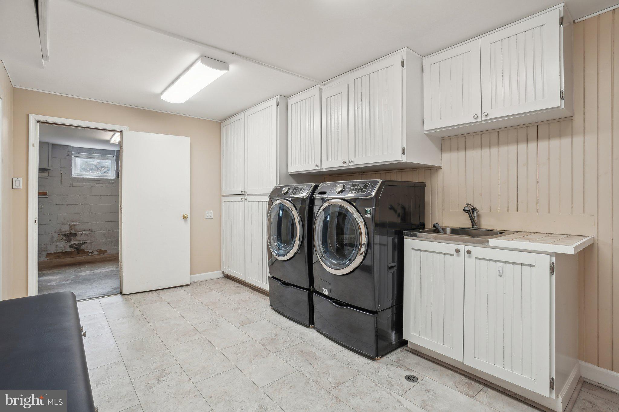 8849 Stark Road Annandale, VA 22003 - Photo 26 of 44 Lower level laundry room connecting to garage