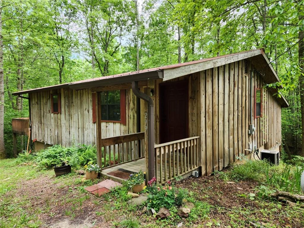299 Yellow Bluff Road Dahlonega, GA 30533 - Photo 1 of 1 Rustic cabin with 1188 sq ft, lots of room, listen to the creek from the master bedroom.