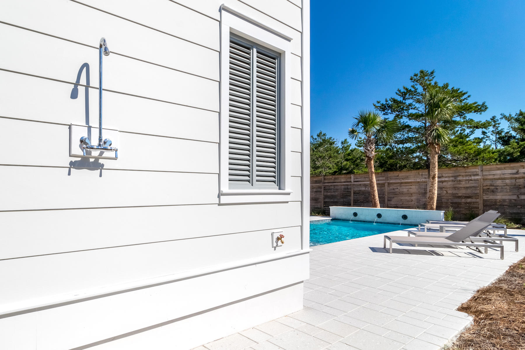 150 Walton Gulfview Dr Inlet Beach Inlet Beach, FL 32461 - Photo 59 of 61 a backyard of a house with table and chairs