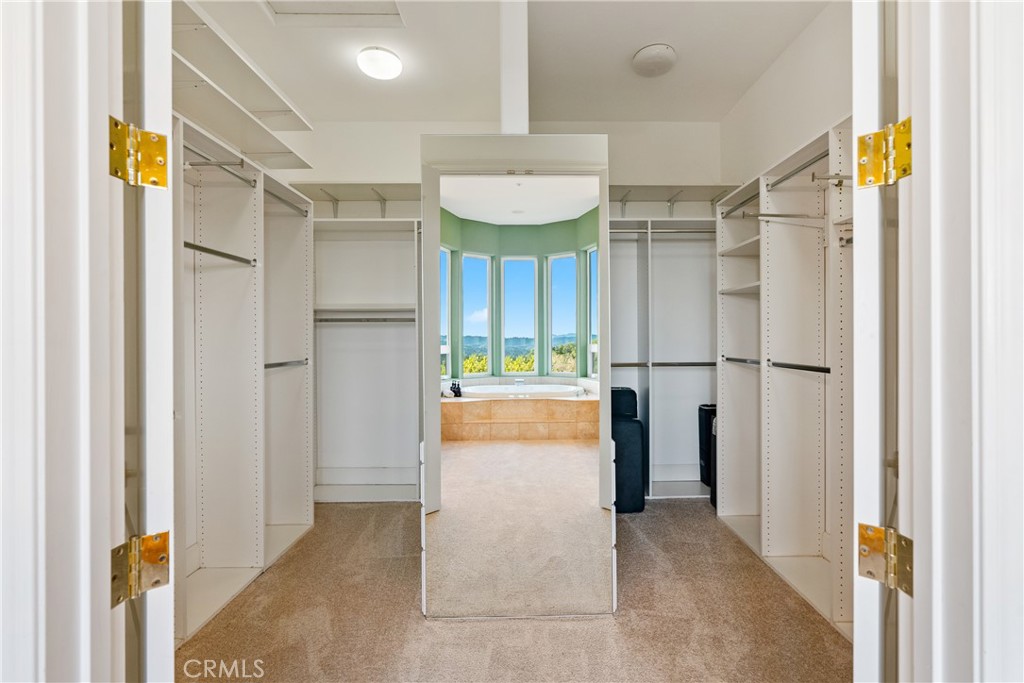 4342 Shadow Canyon Road Templeton, CA 93465 - Photo 32 of 72 A generously sized walk-in closet with built-in cabinetry, providing plenty of room to store and display your clothing and accessories.