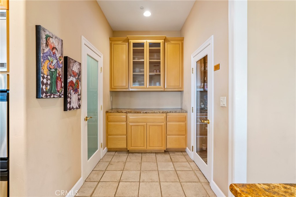 4342 Shadow Canyon Road Templeton, CA 93465 - Photo 40 of 72 To the left, a spacious walk-in pantry offers ample storage, while to the right, a dedicated wine room provides the perfect place to store your collection.