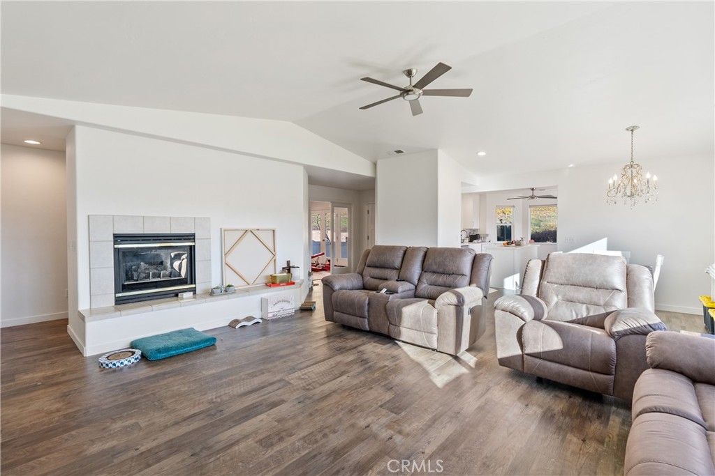 4342 Shadow Canyon Road Templeton, CA 93465 - Photo 57 of 72 Newly remodeled living area with luxury vinyl plank flooring and a cozy fireplace