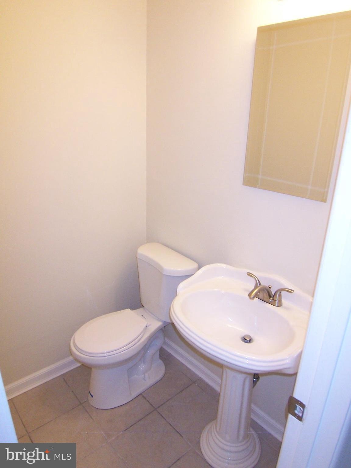 309 Laburnum Road Edgewood, MD 21040 - Photo 13 of 19 a bathroom with a sink and a toilet