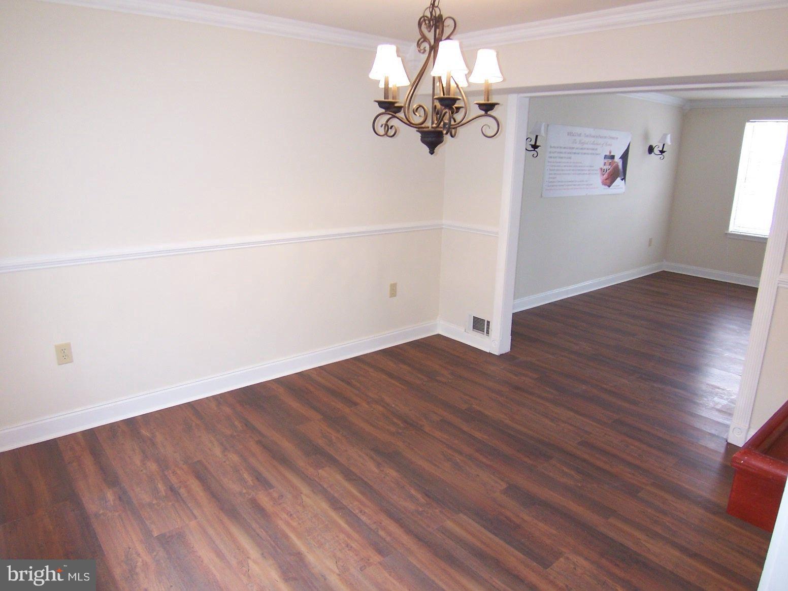309 Laburnum Road Edgewood, MD 21040 - Photo 6 of 19 wooden floor in an empty room with a window