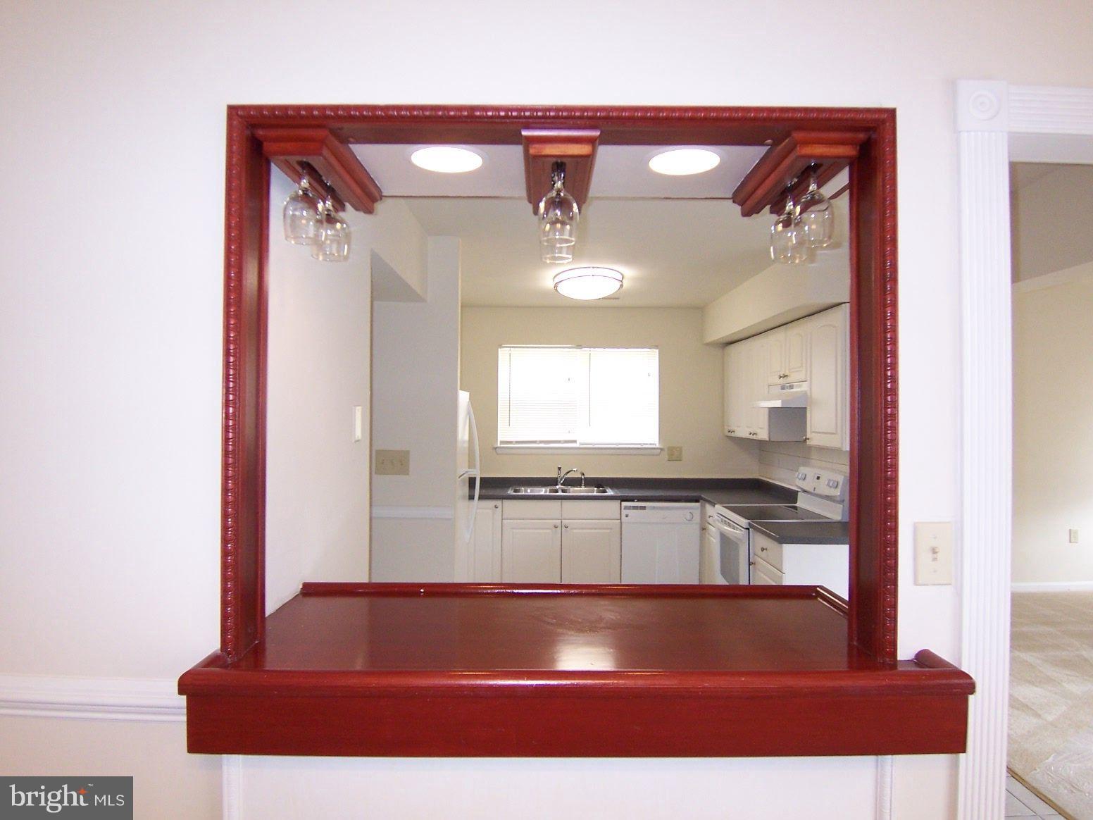 309 Laburnum Road Edgewood, MD 21040 - Photo 8 of 19 a view of a room with kitchen island a window and a couch
