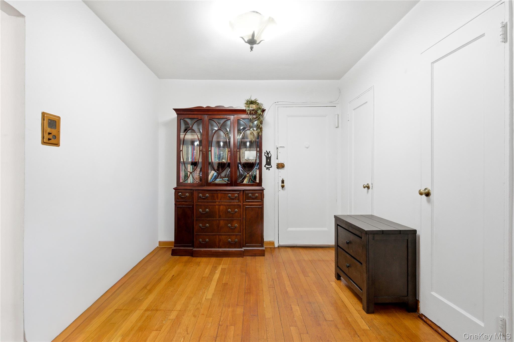 100-11 67th Road, Unit 107 Queens, NY 11375 - Photo 4 of 24 a view of a hallway with wooden floor