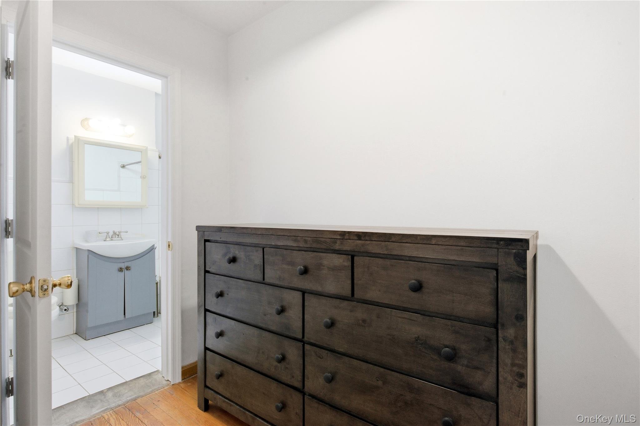 100-11 67th Road, Unit 107 Queens, NY 11375 - Photo 7 of 24 a bathroom with a toilet