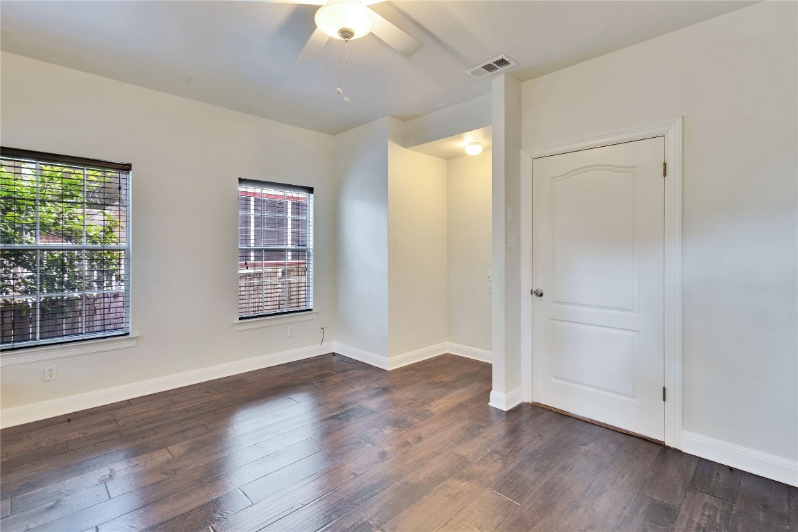 2358 Wilson Street Austin, TX 78704 - Photo 13 of 33 an empty room with wooden floor and windows