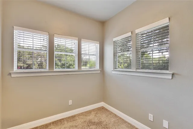 a view of a room that has a window in it