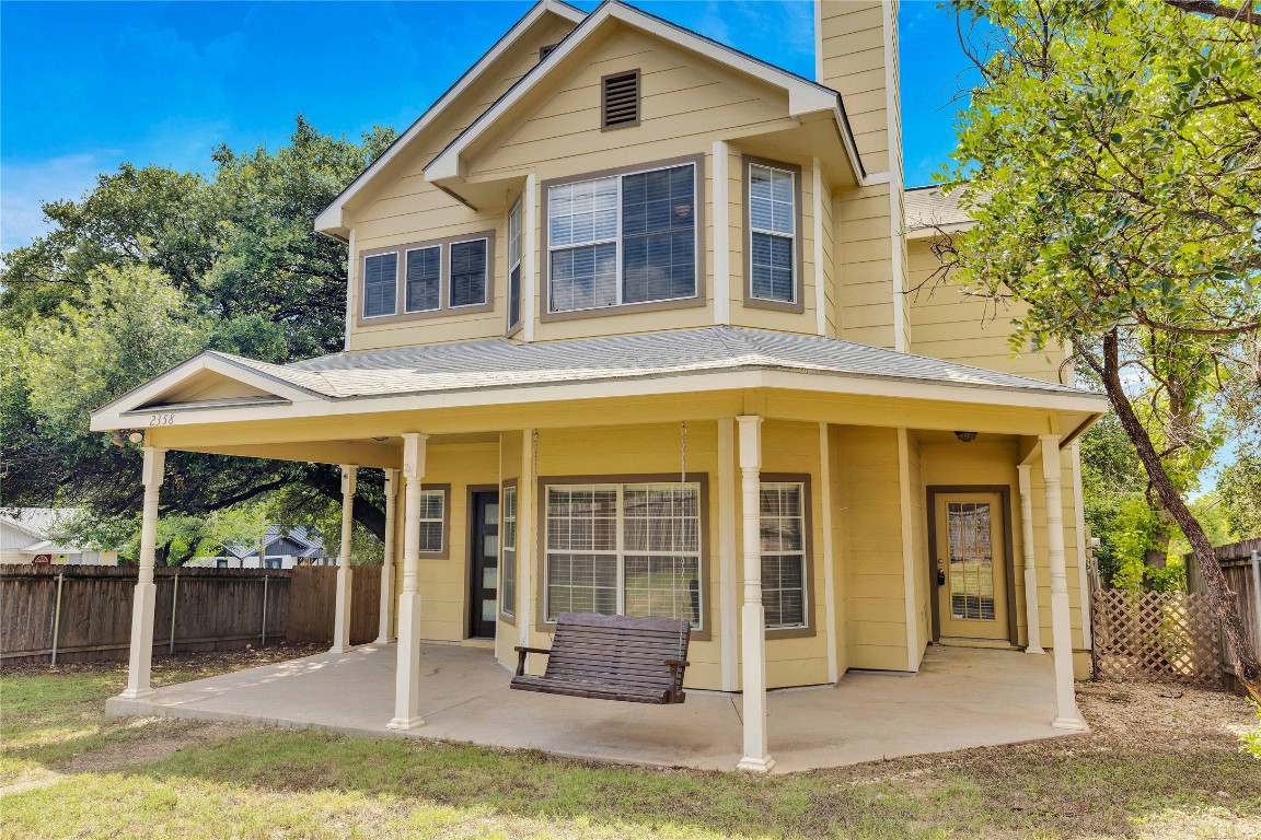 2358 Wilson Street Austin, TX 78704 - Photo 32 of 33 a front view of a house with a yard chairs and floor to ceiling window