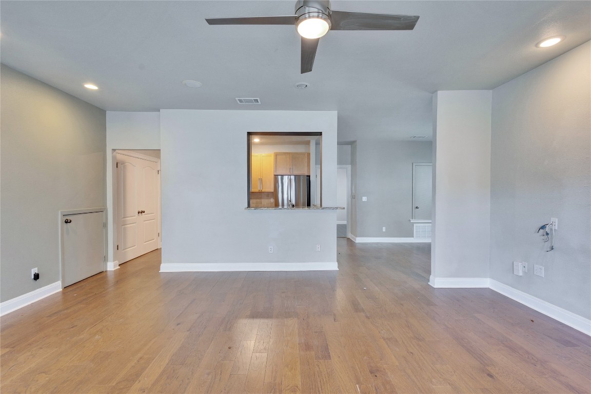 2358 Wilson Street Austin, TX 78704 - Photo 7 of 33 an empty room with wooden floor and windows