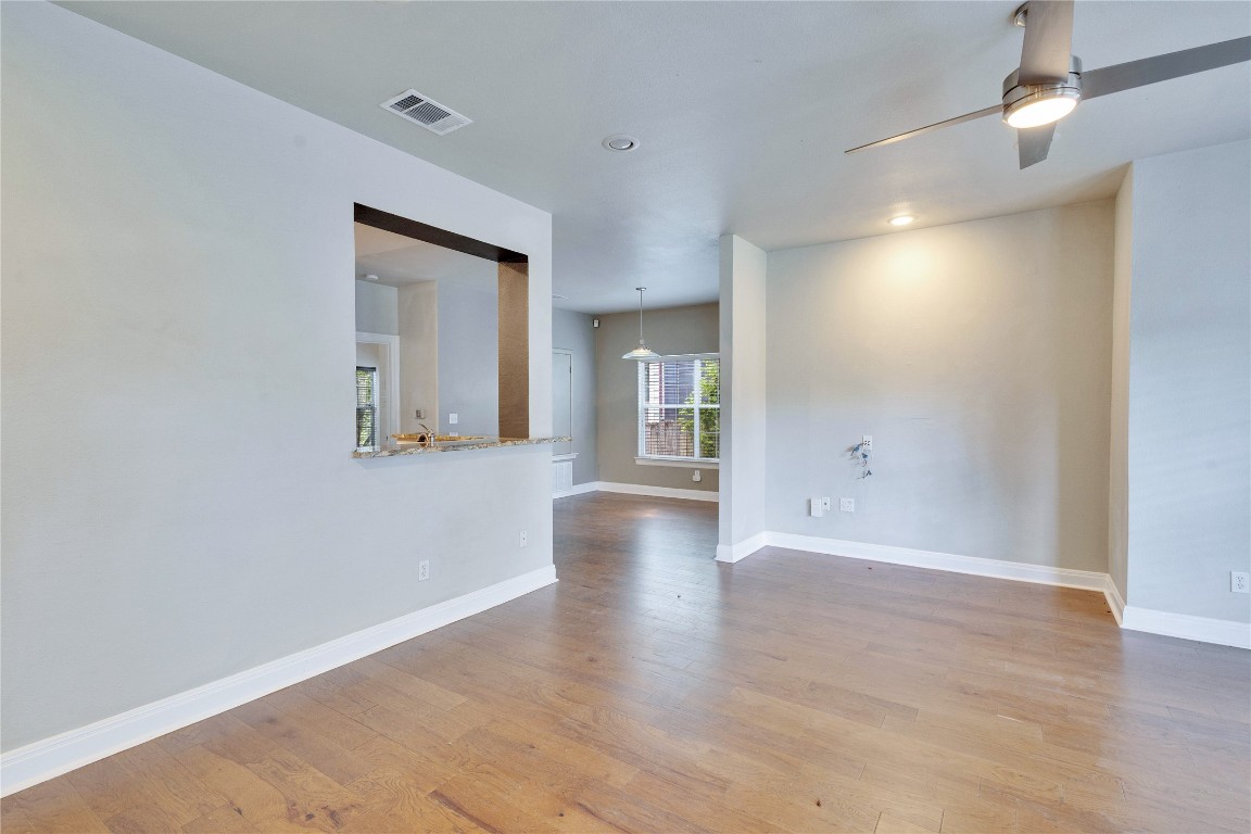 2358 Wilson Street Austin, TX 78704 - Photo 8 of 33 an empty room with wooden floor and windows