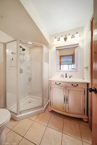 a bedroom with a bed wooden floor and window