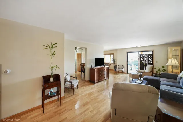 a living room with furniture or couch and a wooden floor
