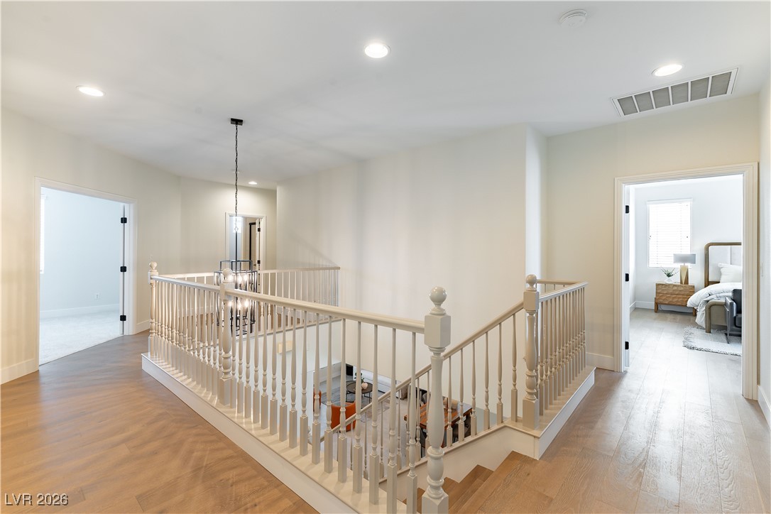 9632 Staff Lane Las Vegas, NV 89178 - Photo 12 of 53 Corridor with an upstairs landing, recessed lighting, and light wood-style floors