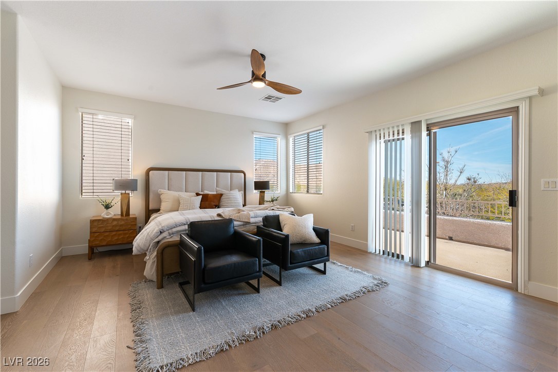 9632 Staff Lane Las Vegas, NV 89178 - Photo 13 of 53 Bedroom featuring light wood-style floors, access to outside, and a ceiling fan