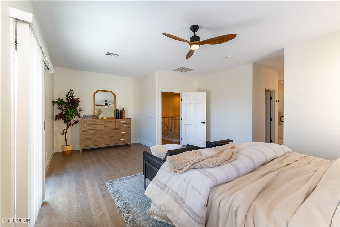 9632 Staff Lane Las Vegas, NV 89178 - Photo 14 of 53 Bedroom featuring wood finished floors and a ceiling fan