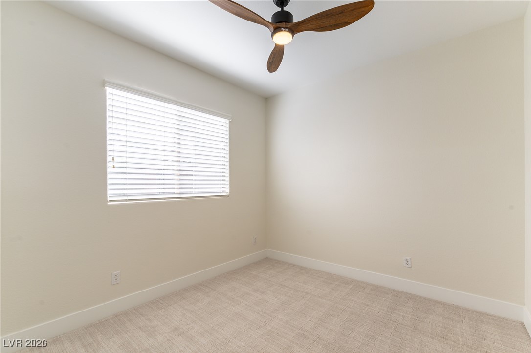 9632 Staff Lane Las Vegas, NV 89178 - Photo 21 of 53 Empty room with light carpet and ceiling fan